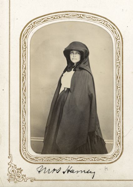 Carte-de-visite portrait of Cordelia Harvey wearing a hooded cape.